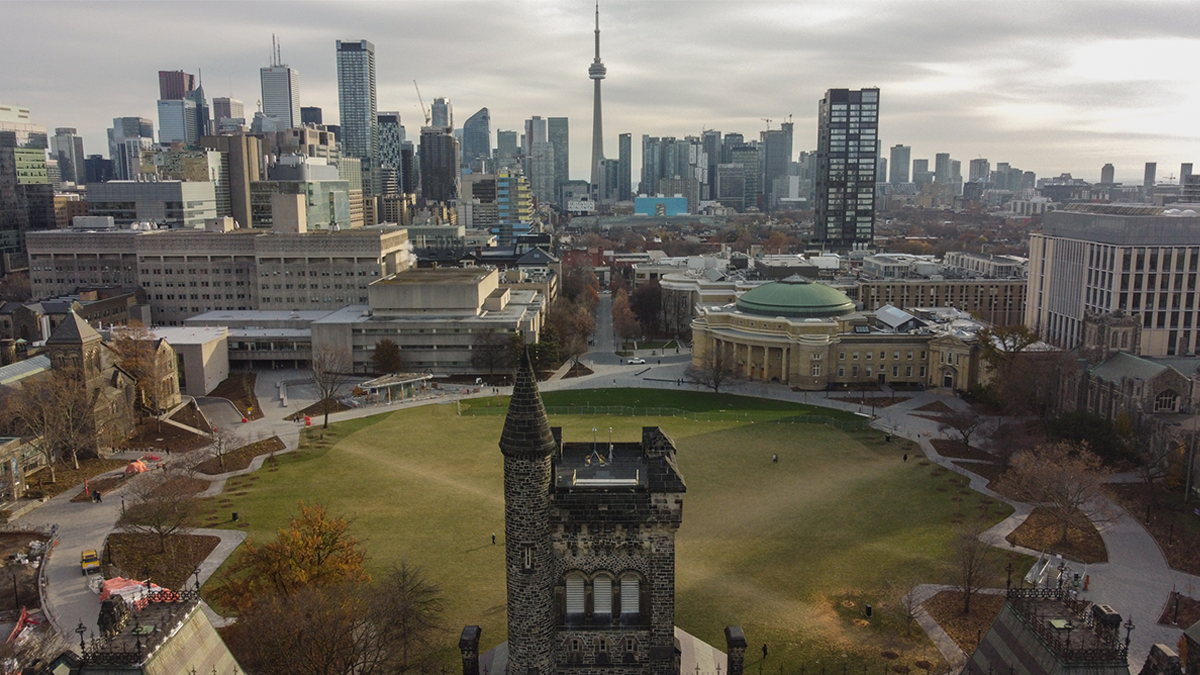 An aerial photograph of the U of T St. George campus, facing south towards the CN Tower.