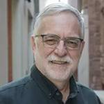 Headshot photograph of University of Toronto professor John Robinson